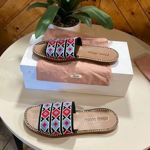 They are brand new , never worn Miu Miu sandals, beautiful colors and patterns.